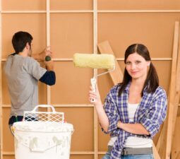 homeimprovementyounghappycouplefixingnewhouserenovatingwall
