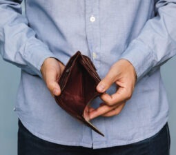 bankruptcy-businesspersonholdinganemptywallet-manshowing