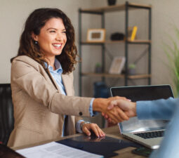 youngwomansigningcontractsandhandshakewithamanager-2