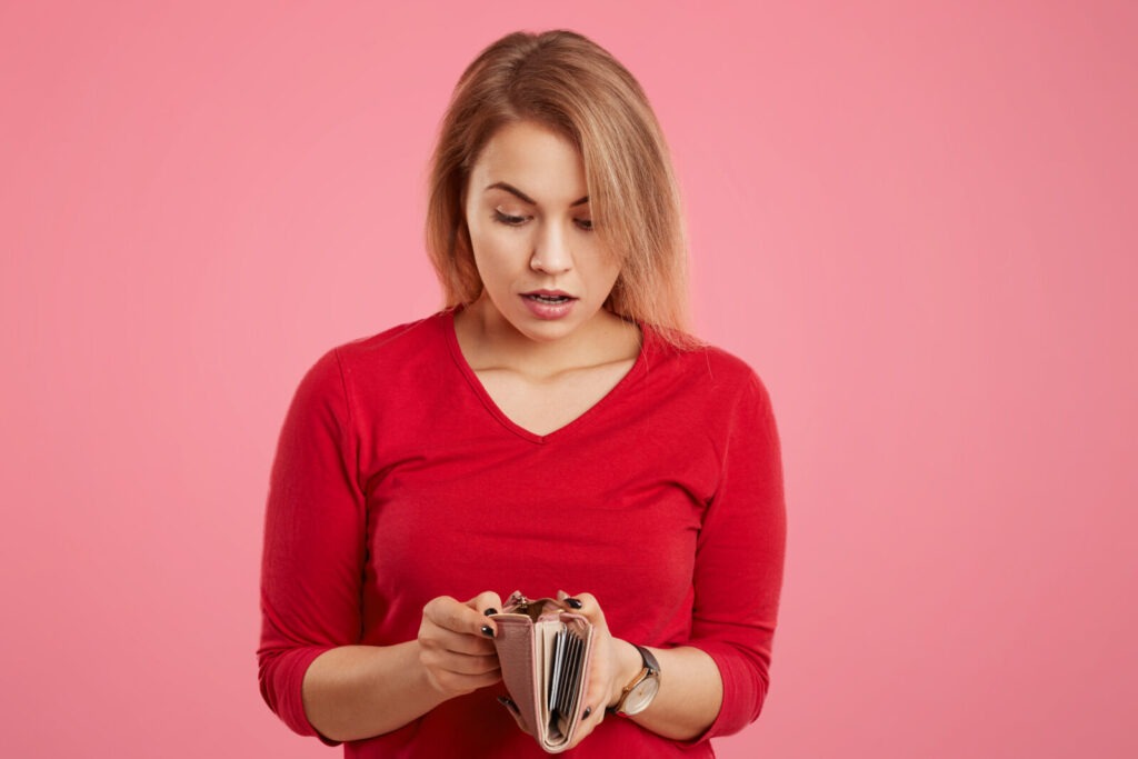 surprisedfemalemodelbeingshortofmoneylookswithshocked