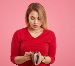 surprisedfemalemodelbeingshortofmoneylookswithshocked